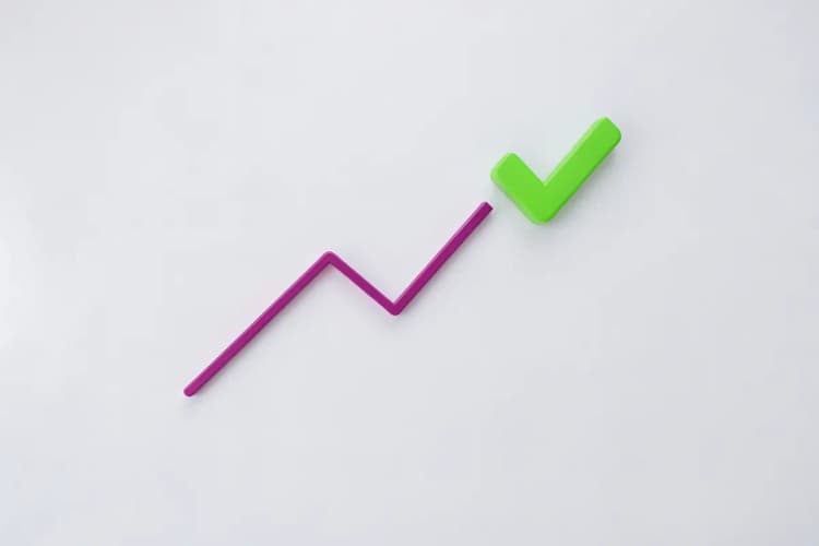 Um gráfico de linha ascendente com um ícone de "check" no final, simbolizando o sucesso de montar um time interno.